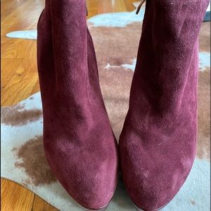 Burgundy suede ankle booties with embellished heel